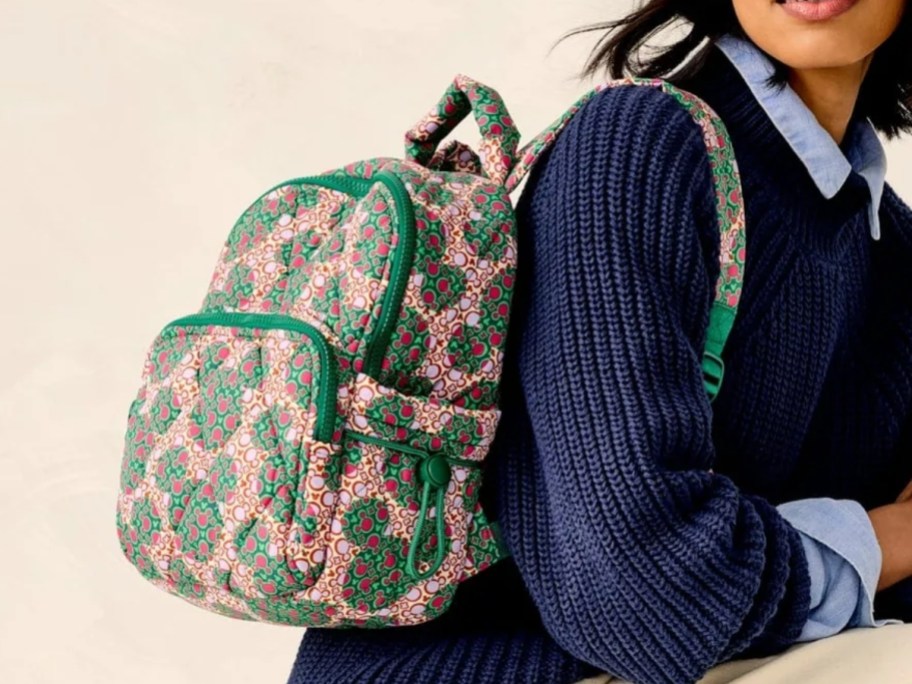 woman with a Vera Bradley Disney Mickey Mouse small backpack on her back