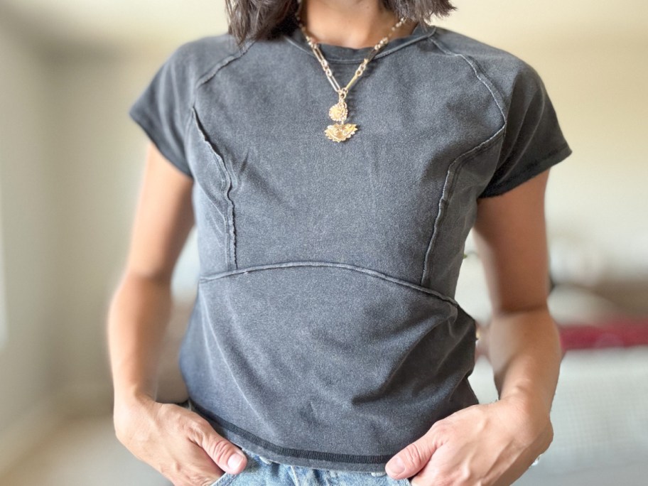 woman in black acid wash tee