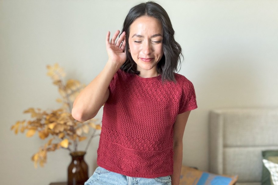 woman in maroon crochet top