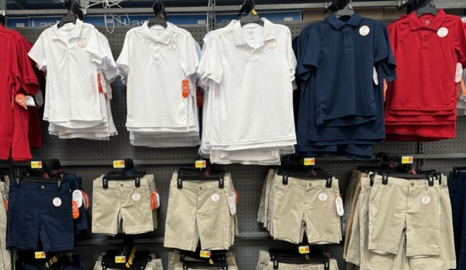 walmart school uniforms shirts and shorts displayed on a store wall