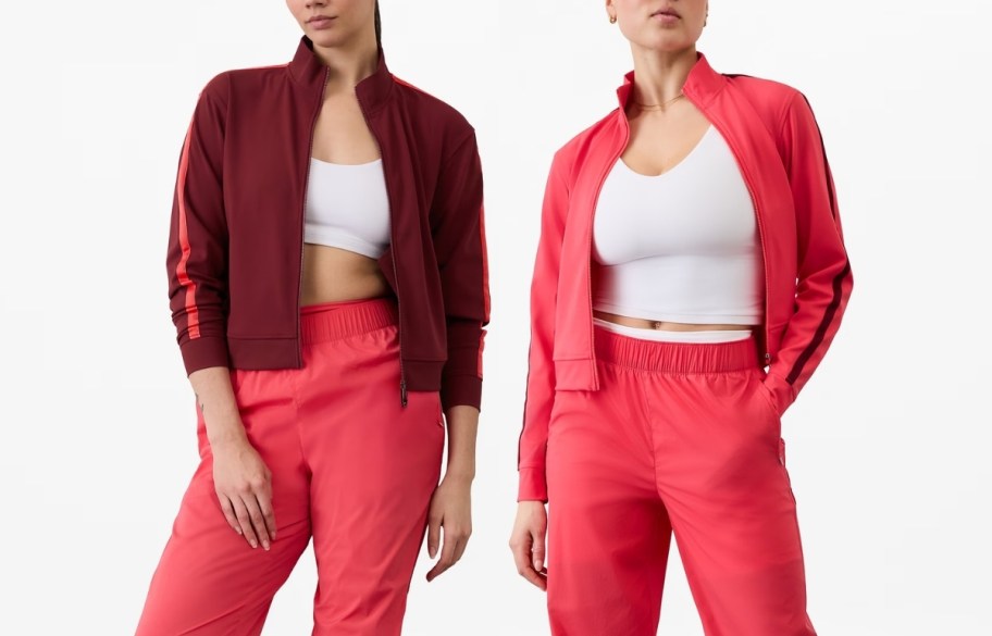 Two models wearing women's finish line jackets 