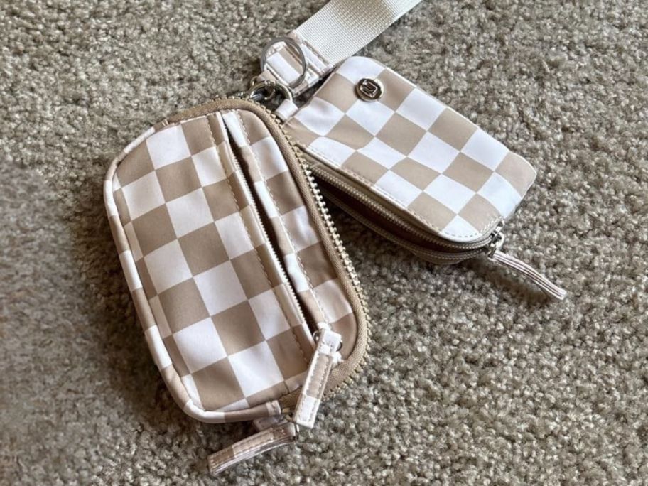 white and beige dual wristlets on carpet