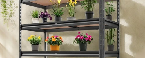 A sturdy metal shelving unit displaying a variety of potted plants with vibrant flowers and green foliage.
