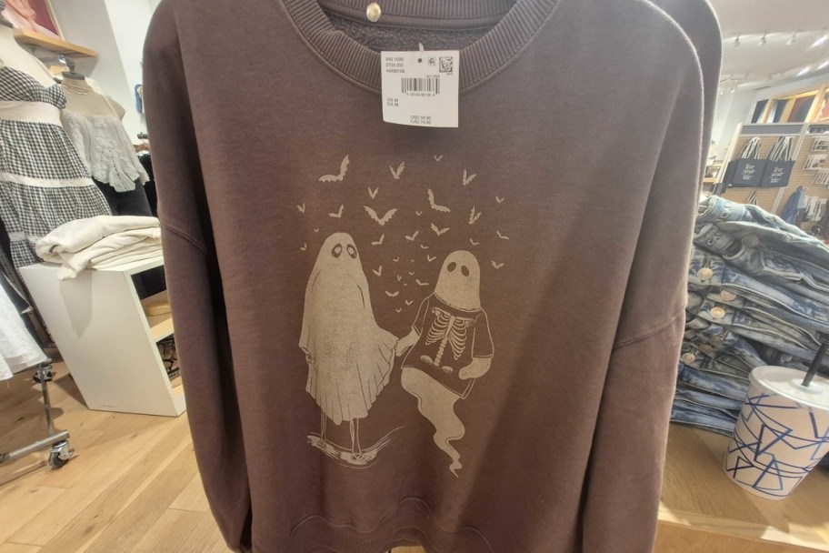 a brown halloween graphic sweatshirt