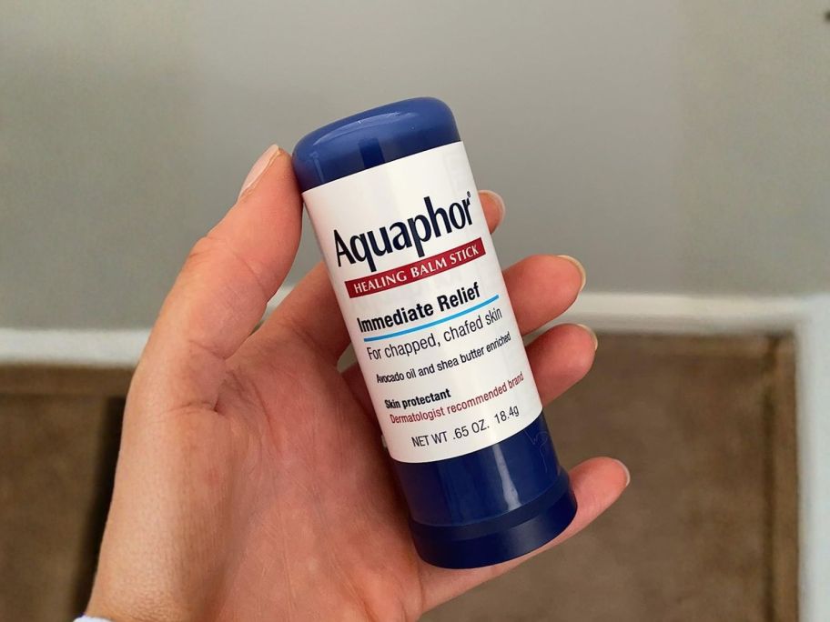 Aquaphor Healing Balm Stick in hand