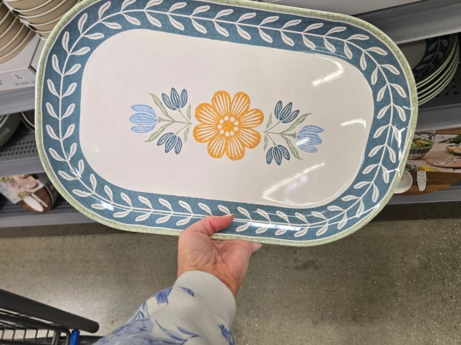 Better Homes & Gardens Bamboo Melamine Floral Serve Tray in hand in store