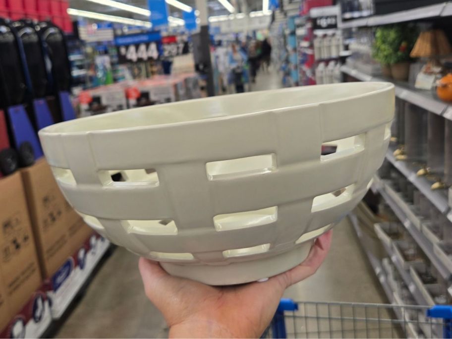 Better Homes & Gardens Ivory Woven Ceramic Decorative Bowl in hand in store