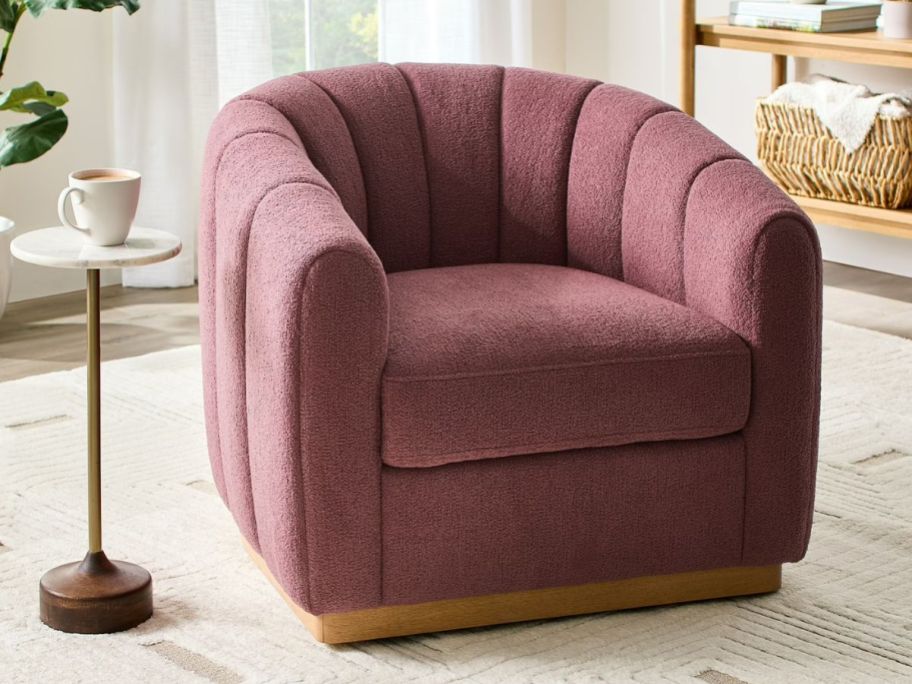 A mauve chair in a living room