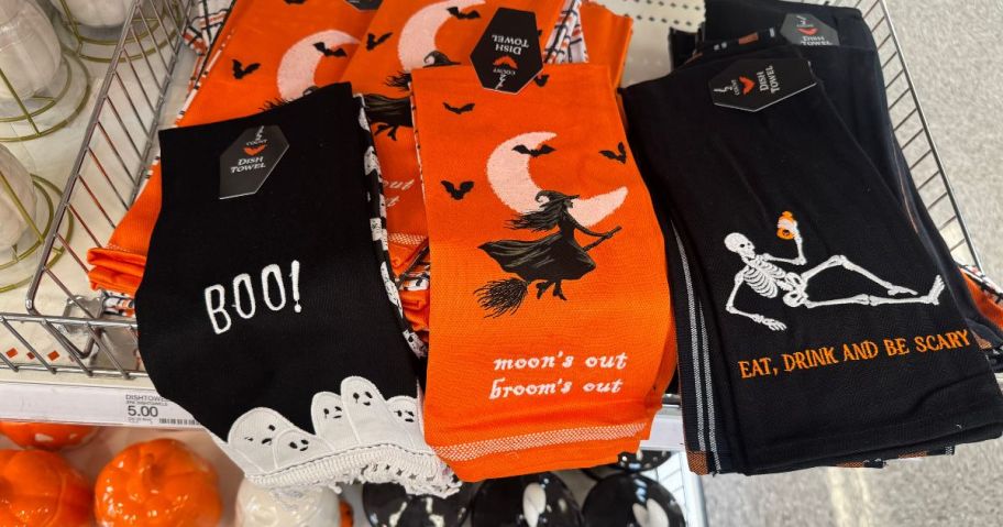 Several Halloween-themed towels in black and orange colors