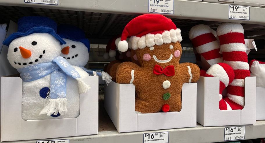 three Christmas Pillows displayed at the store