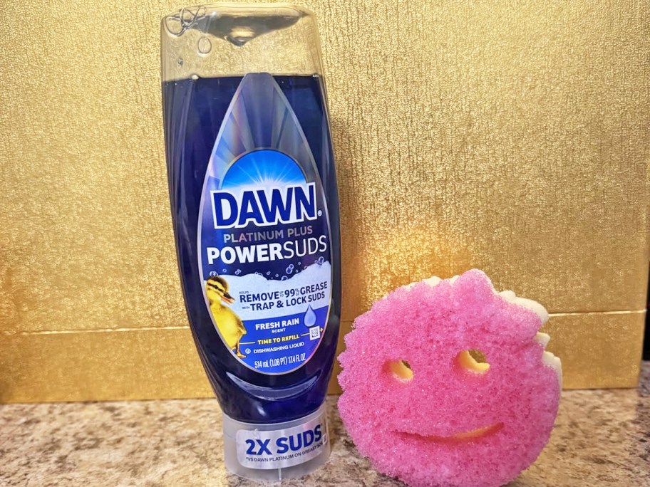 blue bottle of Dawn Platinum Plus PowerSuds next to a Scrub Mommy