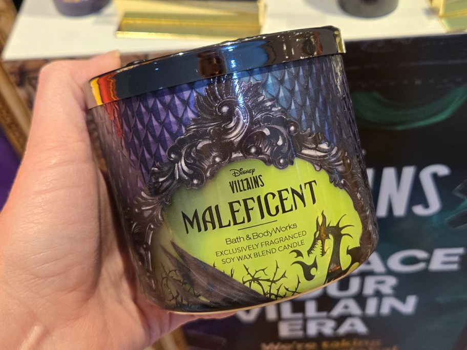 Disney Villains Maleficent three wick Candle being held in the store