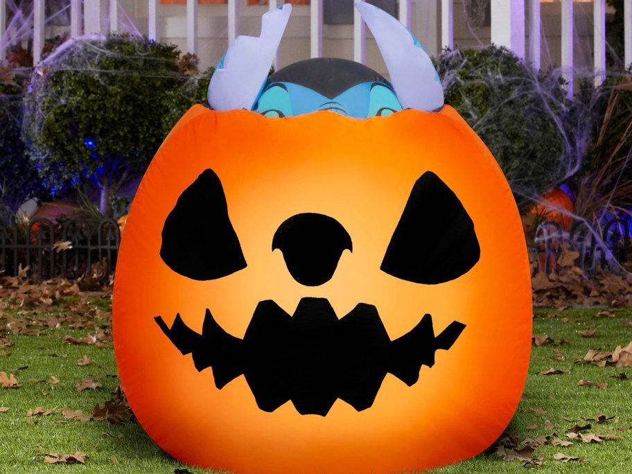 stitch popping out of a pumpkin inflatable