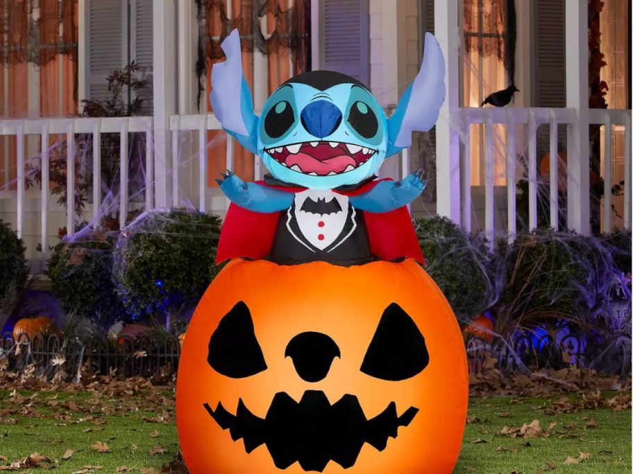 An inflatable Stitch inside a pumpkin on the lawn
