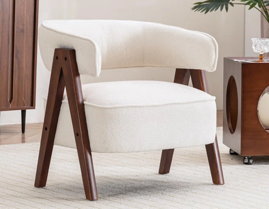 white barrel chair on beige rug