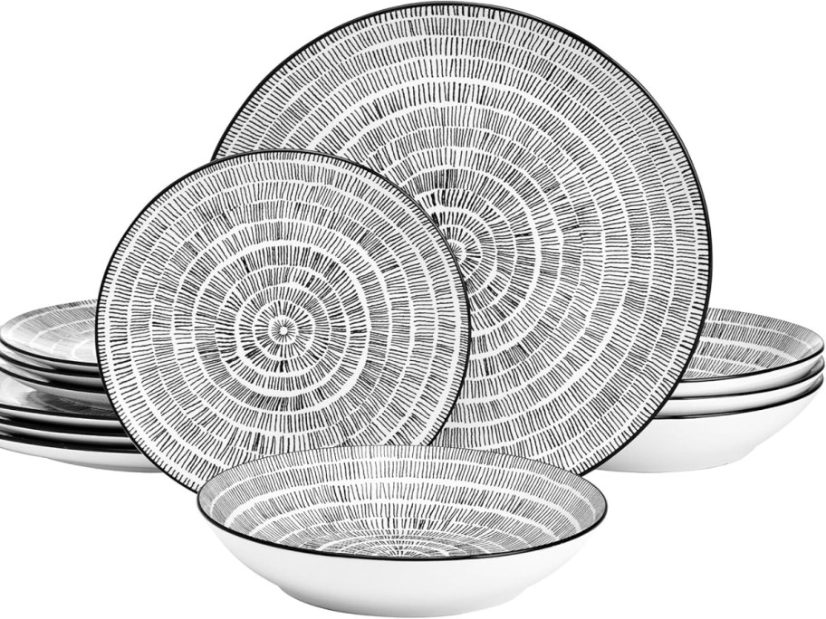 a set of black and white dinnerware plates and bowls