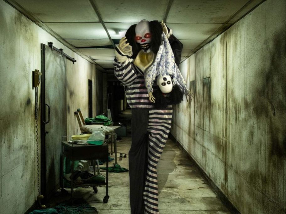 creepy clown in a hospital dressed in a black and white jumpsuit