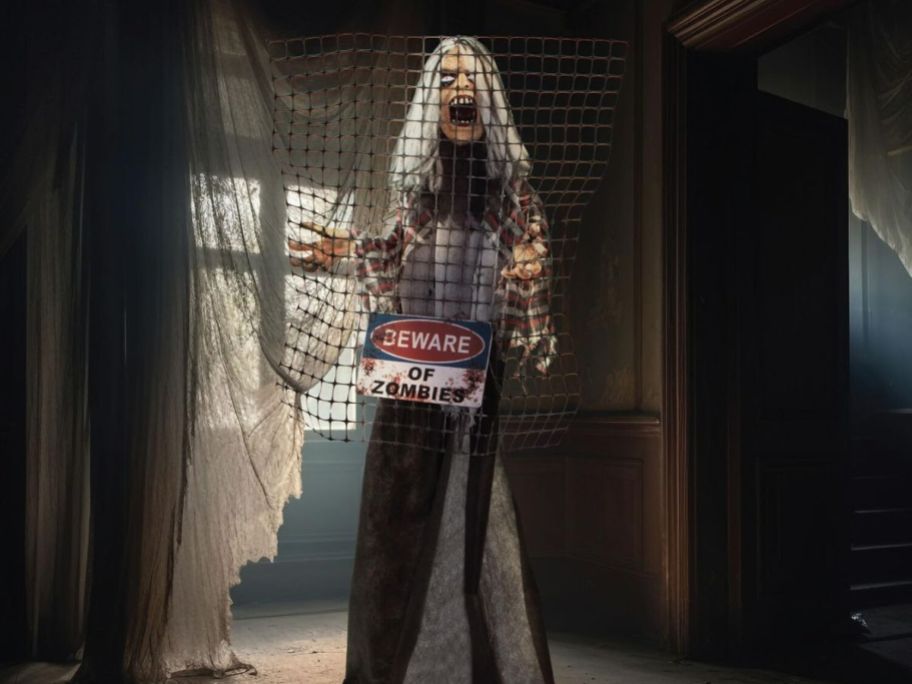 a screaming zombie with an electrocuted fence on them