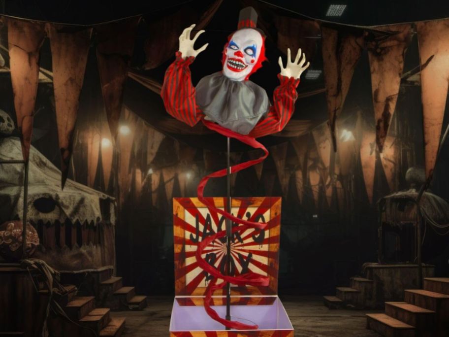 a creepy clown popping out of a jack in the box