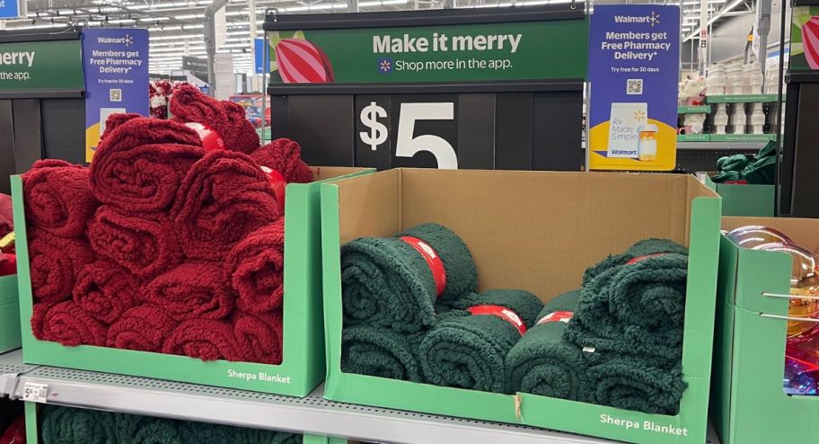 display of Holiday Time Sherpa Throw Blanket in red and green on display 
