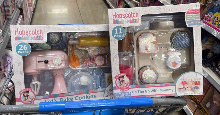 Hopscotch Lane Let's Bake Cookies and On the Go With Mommy Sets in a Walmart cart
