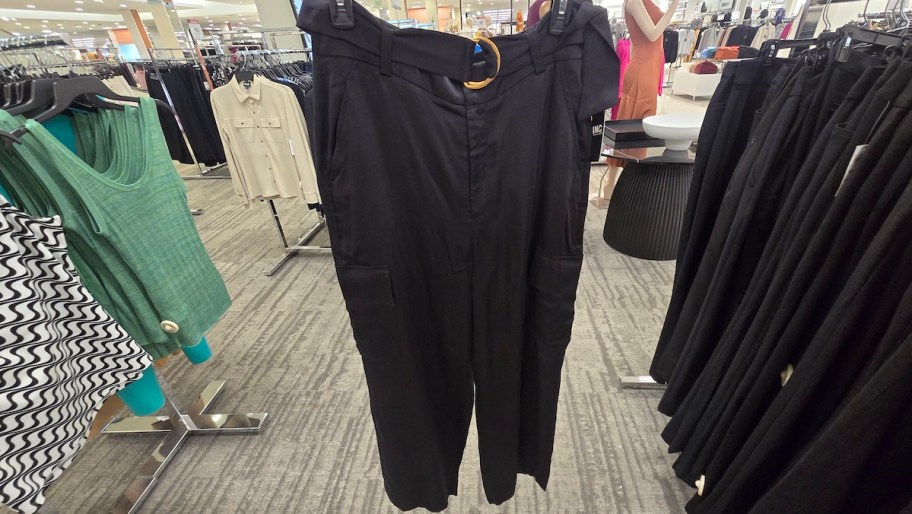 black pants on hanger in store