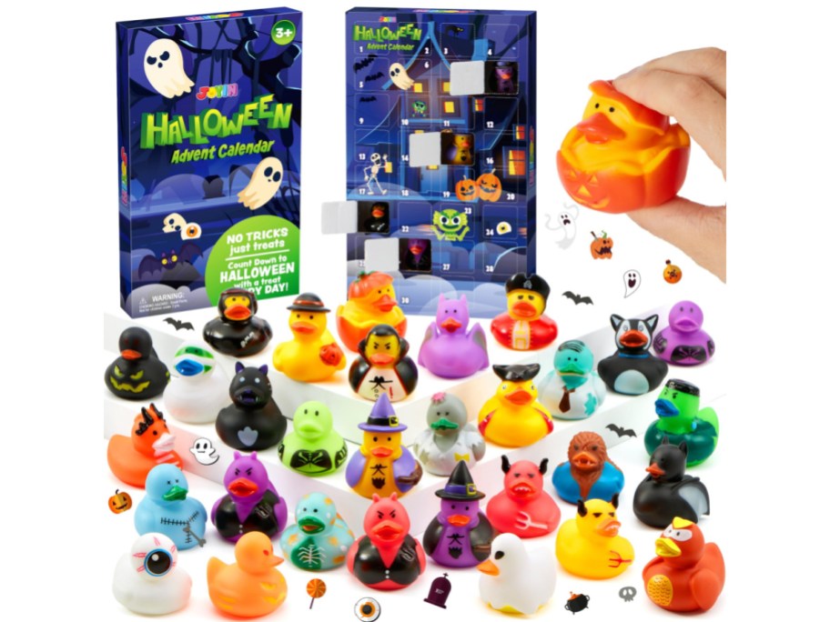 JOYIN Halloween advent calendar box featuring open numbered doors alongside a large collection of colorful rubber ducks in various costumes displayed across the bottom and a hand holding one duck.