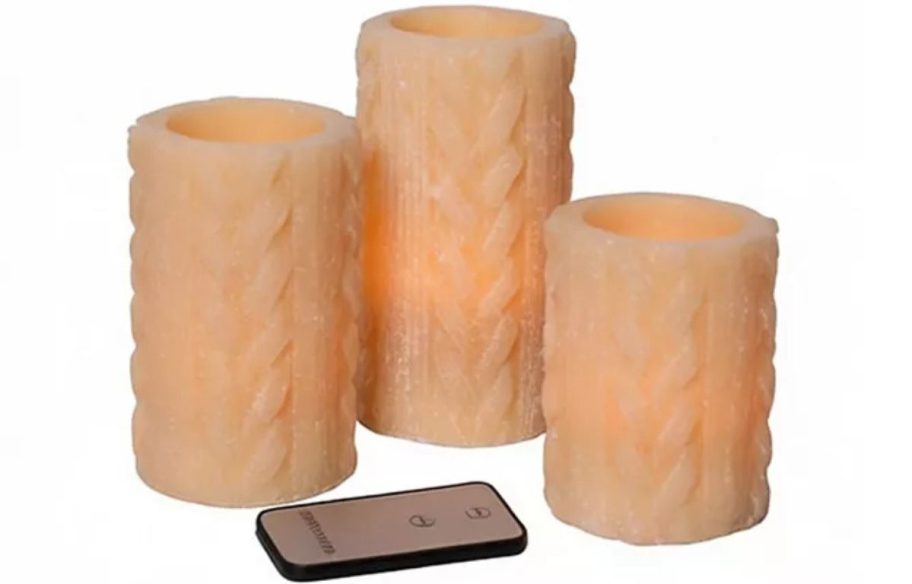 Stock image of a 3-piece sweater knit LED candle set with remote