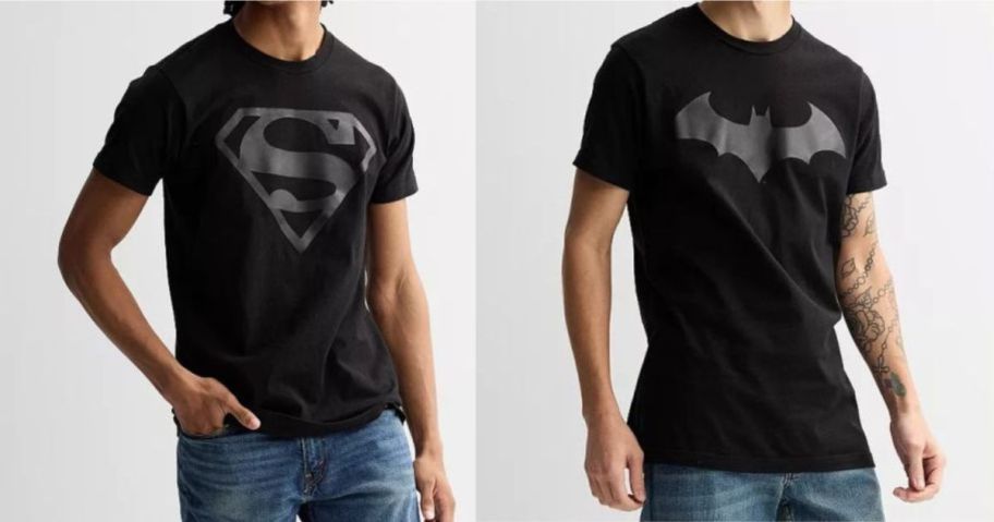 2 men wearing black Superman & Batman Shirts