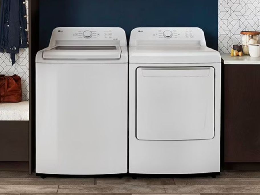 LG 4.1cu. ft. Top Load Washer and-7.3 cu. ft. Electric Dryer in laundry room