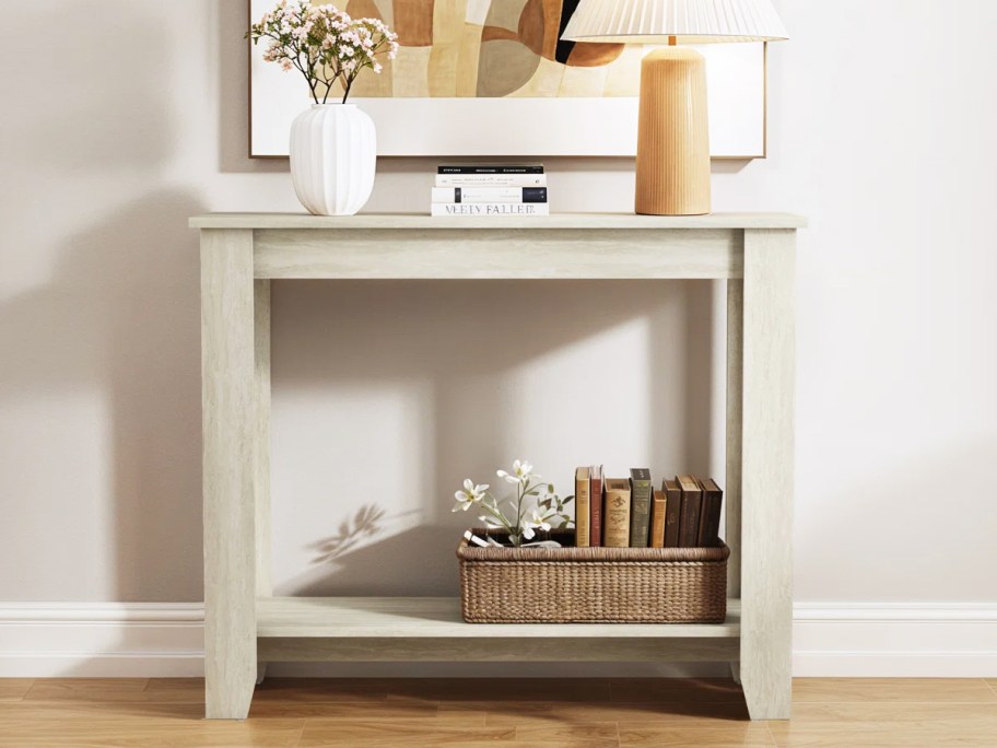 small white console table in entryway