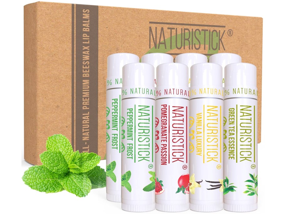 multiple tubes of lip balm in front of a cardboard box