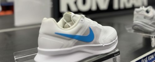 Nike running shoes on display in a store