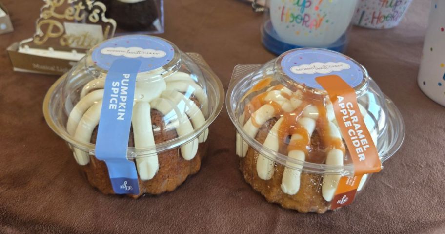 2 small cakes with white icing and one with caramel