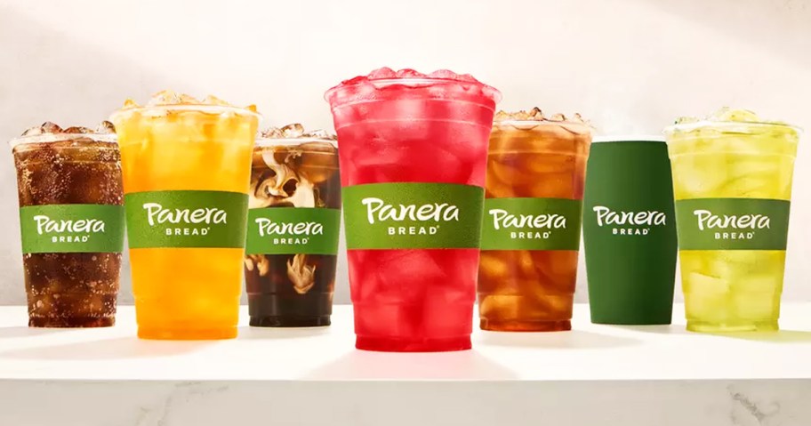 row of panera cups filled with colorful drinks