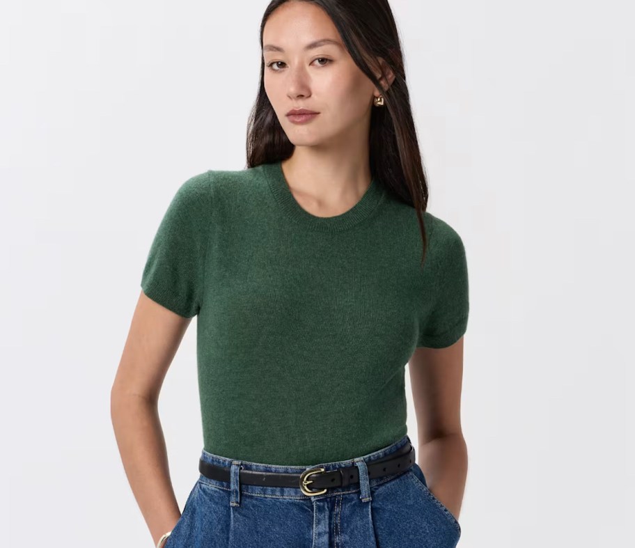 stock photo of woman wearing dark green cashmere tee