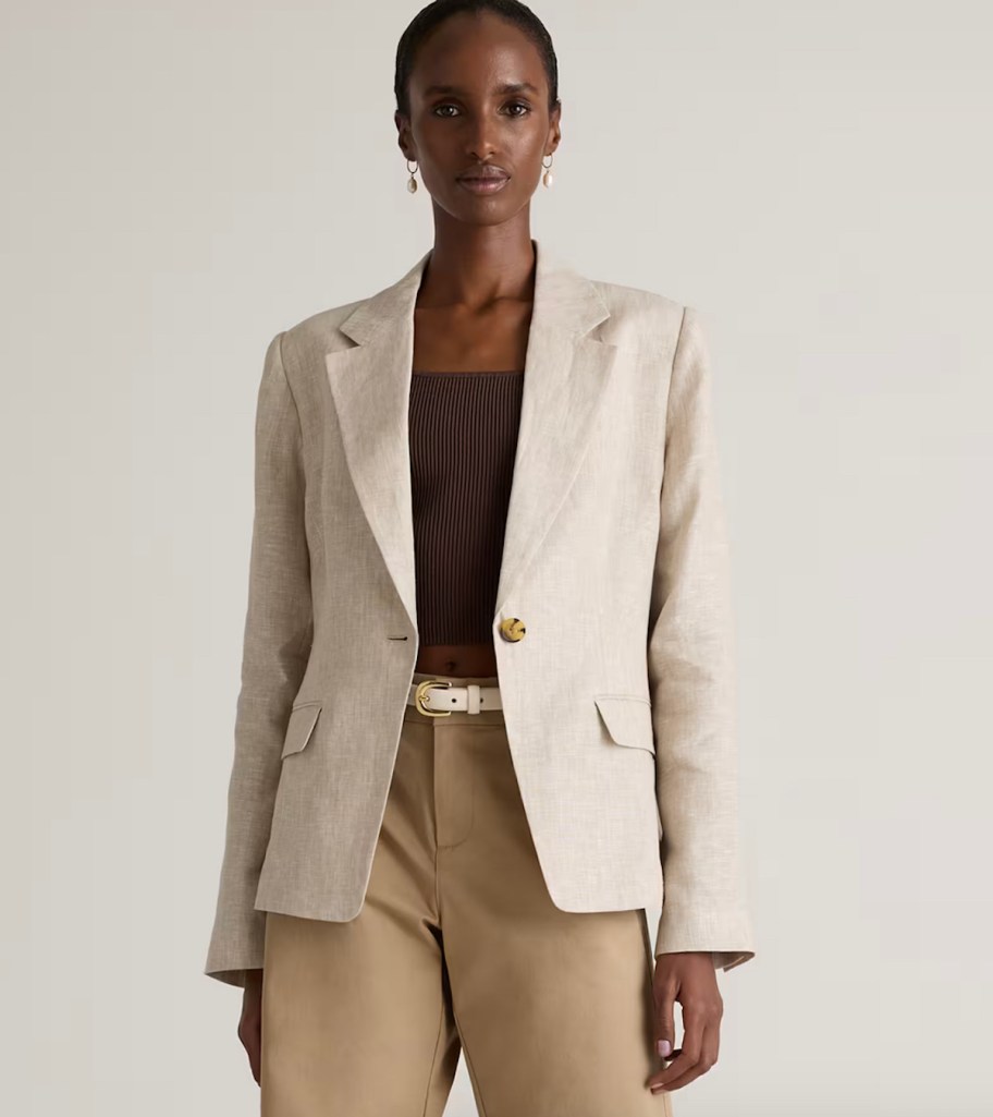 stock photo of woman wearing tan blazer and pants