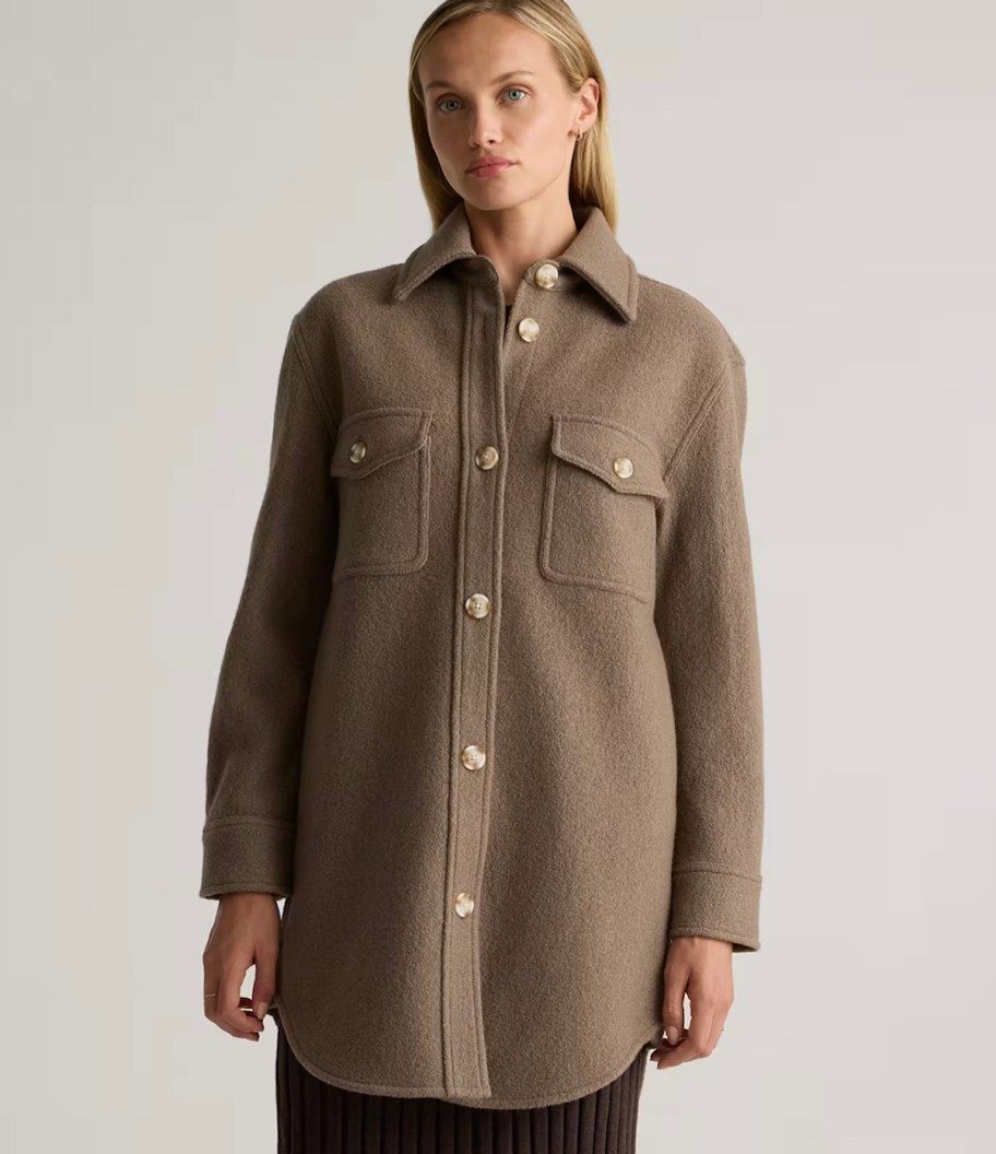 woman wearing brown button down wool jacket