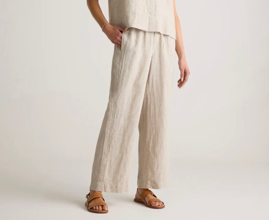 stock photo of woman wearing tan linen pants