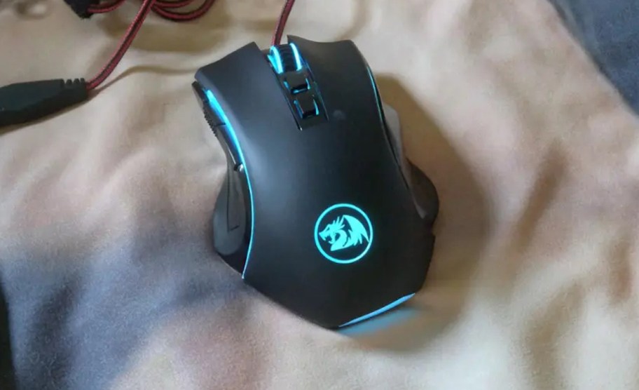 blue light up wired remote on blanket