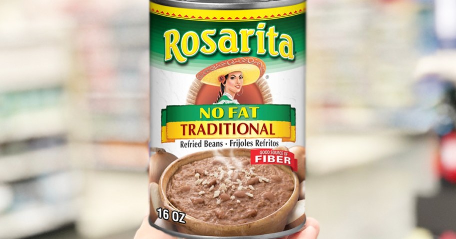 hand holding a can of Rosarita No Fat Traditional Refried Beans