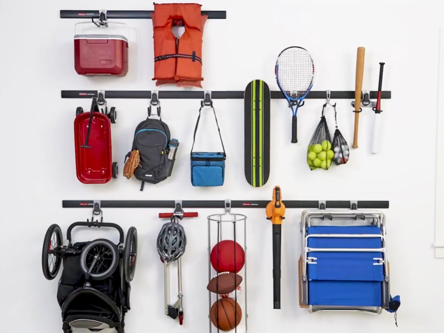 Various items hanging on the garage wall rail system