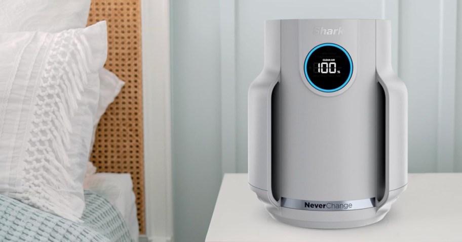 White shark air purifier on bedside table