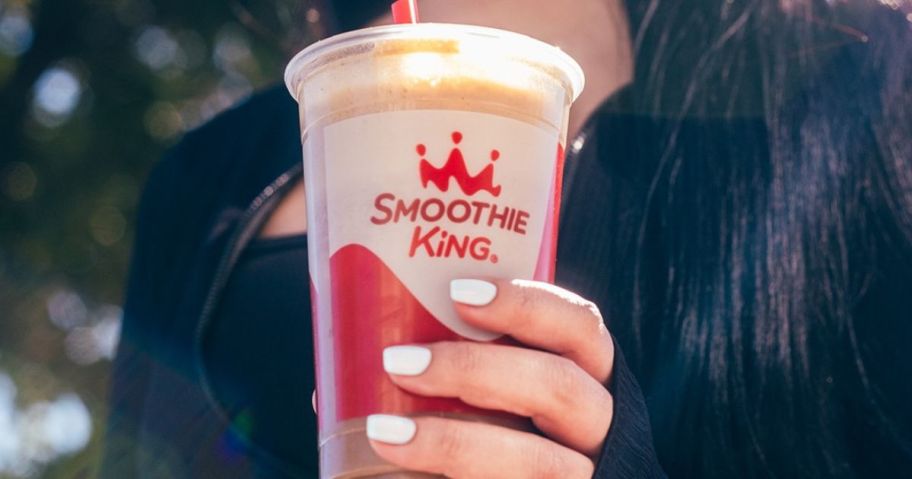 Women's hand Holding a Smoothie King Coffee Protein Smoothie