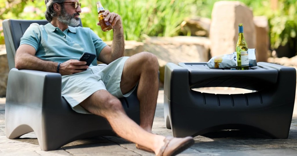 Man sitting in step two chair and drinking beer