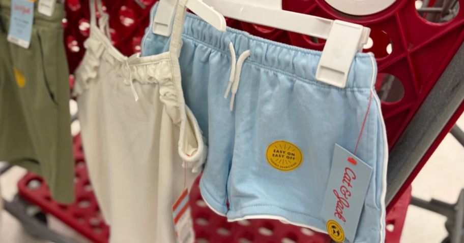 Tank Tops and T-Shirts hanging from a Target shopping cart