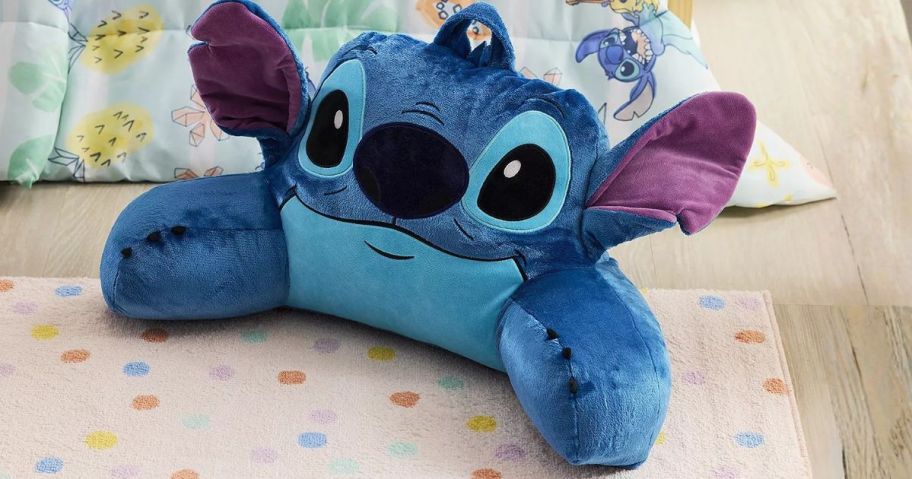 The Big One Disney Backrest Pillow in Stitch on floor in bedroom