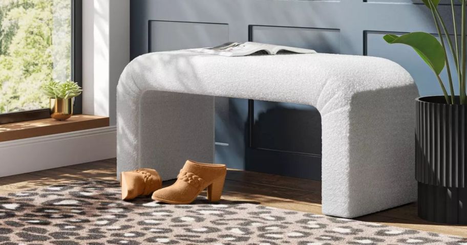 A white bench with rounded edges 