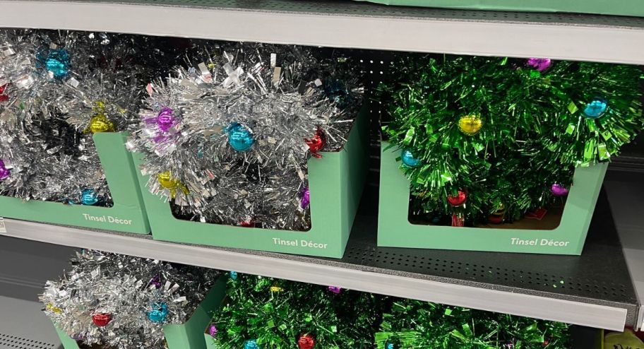 two Tinsel wreaths inside of their box