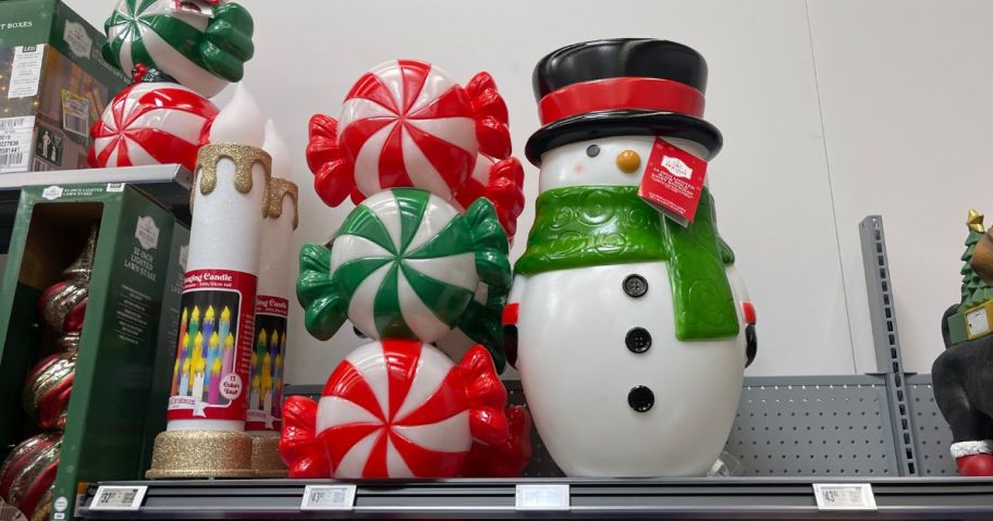 Christmas candy & Snowman blow molds on a shelf